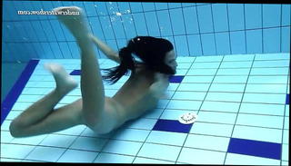 Watch the video about Underwater swimming stripping babe Zhanetta