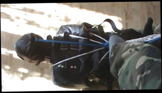 Watch the video about Slave hogtied in the straitjacket