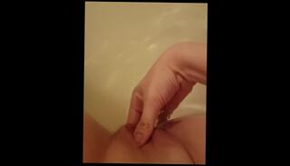 Watch the video about Rubbing my wet pussy in the bath