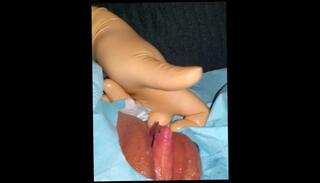 Watch the video about FTM gets clit handjob while being finger fucked with surgical gloves