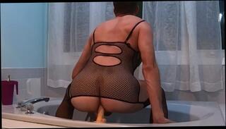 Watch the video about Wearing her fishnets corset and fucking my ass with a dildo