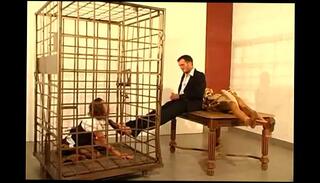 Watch the video about German secretary girl licks feet and sucks cock of her boss in cage