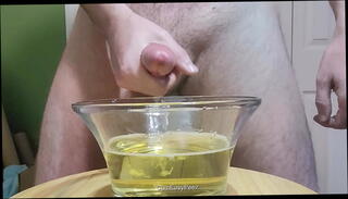 Watch the video about Jerking off in a bowl of piss