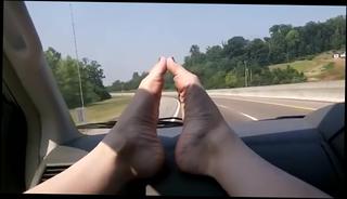 Watch the video about Sexy barefoot car ride