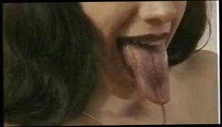 Watch the video about Kissing lesboss Extreme long tongue