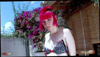 Watch the video about Pretty little redhead Punk stripping on the terrace