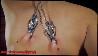 Watch the video about Tormented chained babe plays with toys