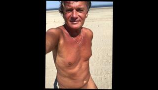 Watch the video about UltimateSlut WALKING THE NUDE BEACH