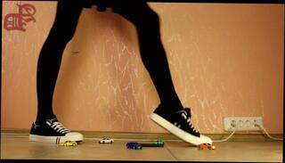 Watch the video about TRANNY GIANTESS CRUSHES TOY CARS IN SNEAKERS, MINI SKIRT AND DARK PANTYHOSES - 1 (CRUSH FETISH)