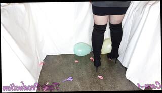 Watch the video about Girlfriend just loves popping baloons in thigh high boots