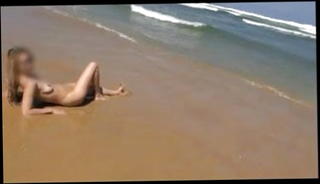 Watch the video about Blonde teen Sandrine at beach