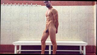 Watch the video about Fit stud naked in public locker room flexing muscles after gym training