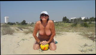 Watch the video about Nude with ball on the beach