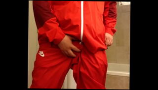 Watch the video about Returning in a red Nike windsuit