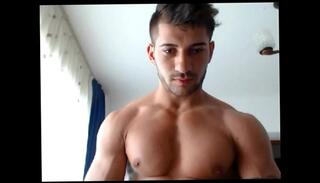 Watch the video about Cute 21yo muscle boy flexes his big muscles on cam for you