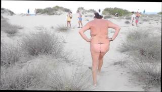 Watch the video about Nudist old woman on public beach