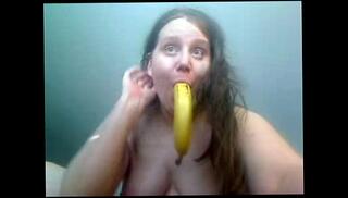 Watch the video about Amateur girl playing with banana