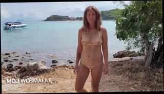 Watch the video about Transparent micro bikini on public beach