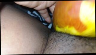 Watch the video about Massaging hairy pussy with fruit late night