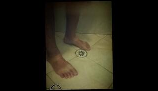 Watch the video about Soapy shower feet and rubbing one down - peephole view